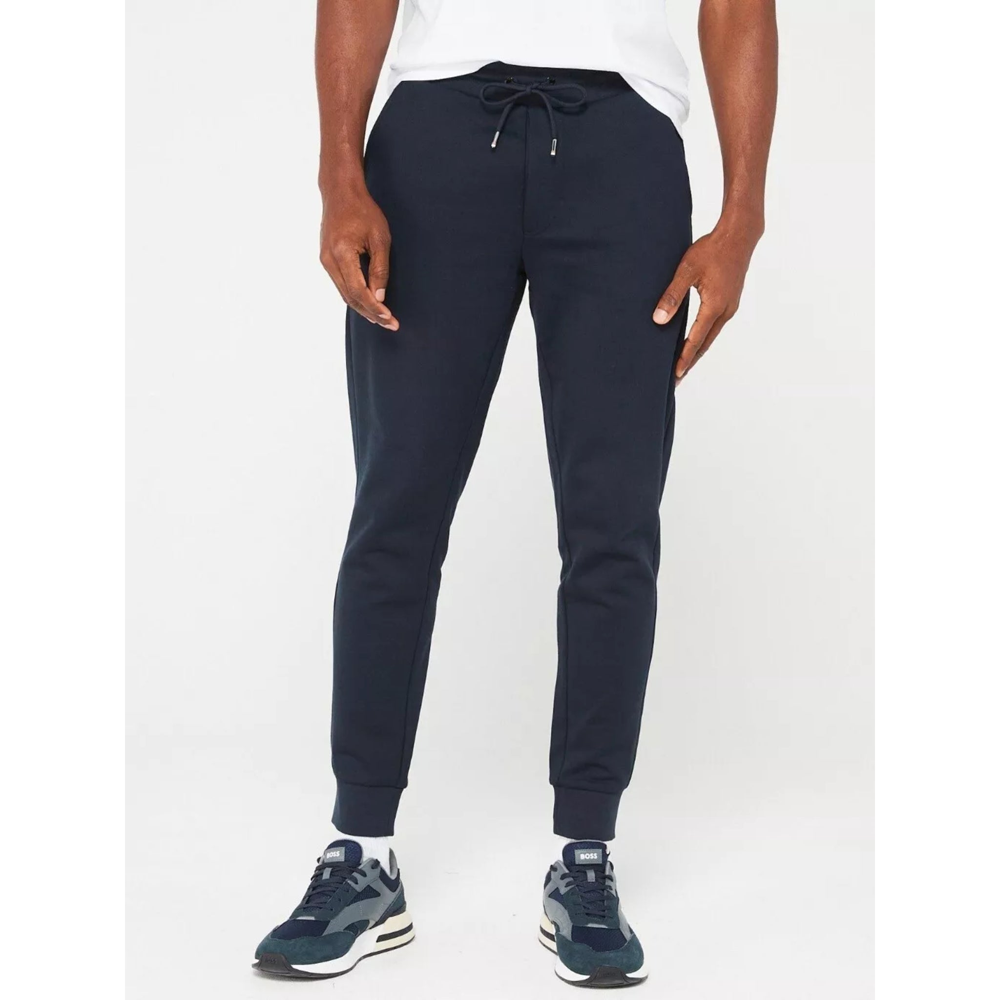 Men's navy blue slim fit jogging bottoms with drawstring waist and cuffed ankles
